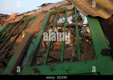 Gaza, Palestinian Territories, . 20th Nov, 2013. A Palestinian man inspects damage of his a chicken farm after it was targeted in an overnight Israeli air strike in Khan Younis in the southern Gaza Strip November 20, 2013. Israel carried out four air strikes on the Gaza Strip in retaliation for rocket fire against southern Israel, an army spokesman said. There were no immediate reports of casualties, Palestinian medics and witnesses said.Photo: Yasser QudihÃƒÂ¾/NurPhoto Credit:  Yasser Qudih/NurPhoto/ZUMAPRESS.com/Alamy Live News Stock Photo