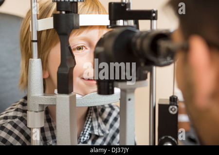 Boy's Eyes Being Examined By Slit Lamp Stock Photo