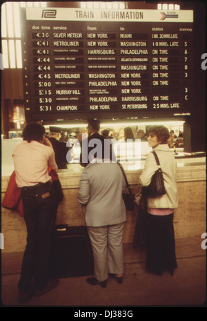 AMTRAK PASSENGERS STOP FOR TRAIN INFORMATION IN THE MAIN HALL OF THE 30TH STREET STATION IN PHILADELPHIA . 688 Stock Photo