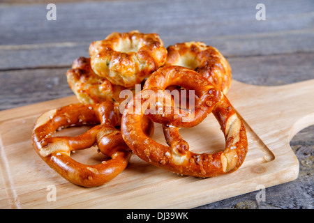 Soft newly-baked rolls on an old kitchen table Stock Photo