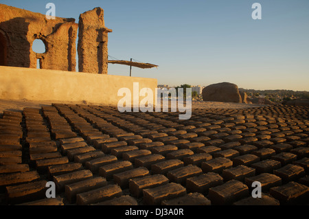 Hand-made mud bricks drying within the Fatamid cemetery at Aswan, Egypt. Stock Photo