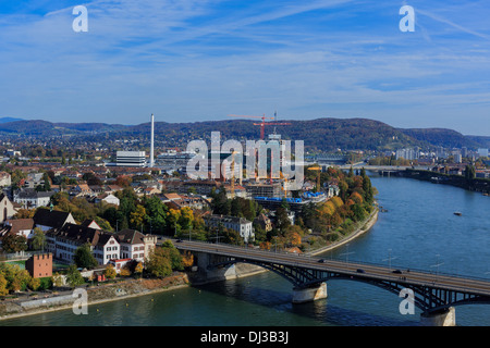 A photograph of the skyline of Basel, Switzerland. Taken at the start of the Autumn fair on a beautiful sunny day.