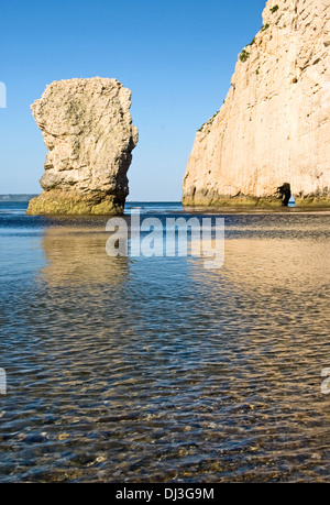 Chalk sea stack and opening in the chalk cliff face of Bats Head, on Dorset's Jurassic coastline.