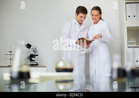 Two scientists working in lab Stock Photo
