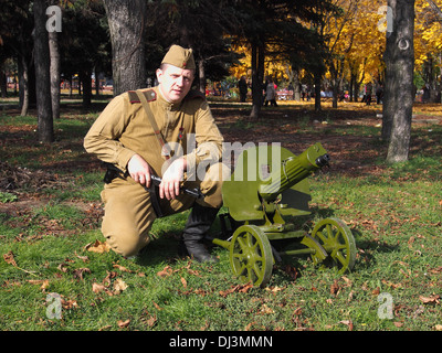 Redator Machine Gun re-enactor in the form of a Red Army soldier with a machine gun Maxim ...