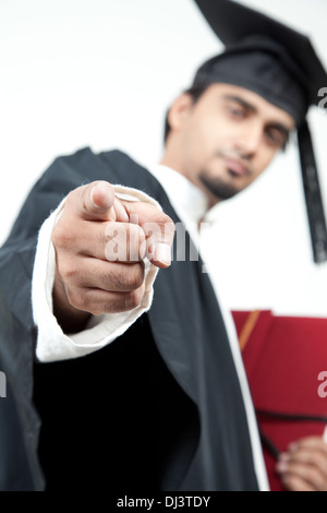 Asian student graduates pointing finger at the camera Stock Photo