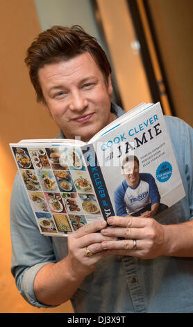Berlin, Germany. 21st Nov, 2013. The British celebrity chef Jamie Oliver presents his new cookbook 'Cook clever with Jamie' in Berlin, Germany, 21 November 2013. Jamie Oliver's new book deals with the question of how to create delicious dishes for the whole family despite a limited budget. Photo: JOERG CARSTENSEN/dpa/Alamy Live News Stock Photo