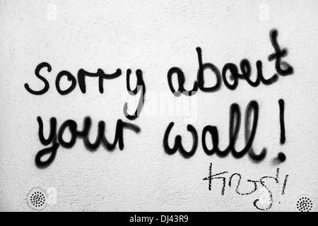 Graffiti on wall ( sorry about your wall ) Stock Photo