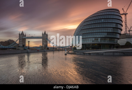 Tower Bridge alongside City Hall on the banks of the River Thames in London Stock Photo