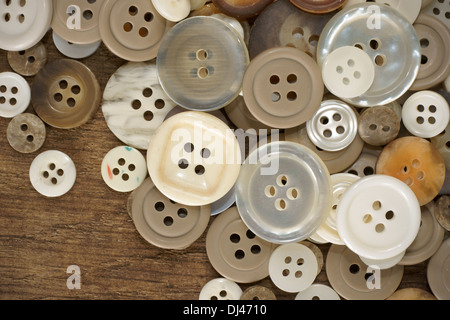 Stack of old fashioned brown beige and white buttons Stock Photo