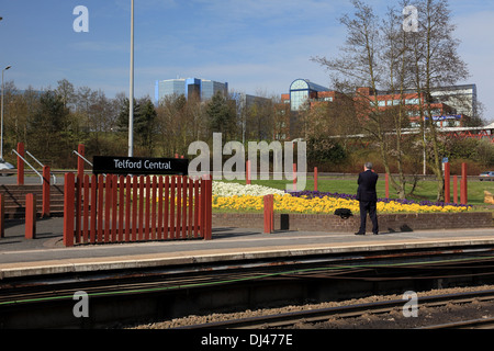 Telford station platform with the town centre high rise office buildings in the background Stock Photo