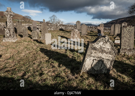 A Scottish Highland graveyard in low winter sun Stock Photo