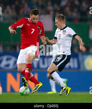 Vienna, Austria. 19th Nov, 2013. The USA's Aron Johannsson (R) vies for the ball with Austria's Marko Arnautovic during the friendly match between Austria and the USA at Ernst Happel Stadium in Vienna, Austria, 19 November 2013. Photo: Thomas Eisenhuth/dpa/Alamy Live News Stock Photo