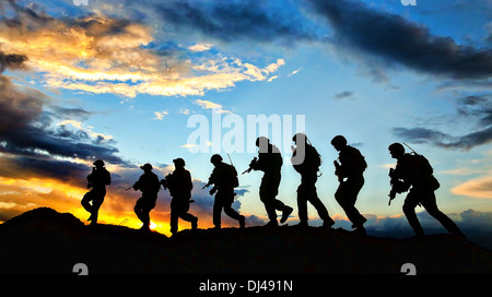 Australian army soldiers with the The Royal Australian Regiment patrol at sunrise November 6, 2013 at Multinational Base Tirin Kot, Uruzgan province, Afghanistan. Stock Photo