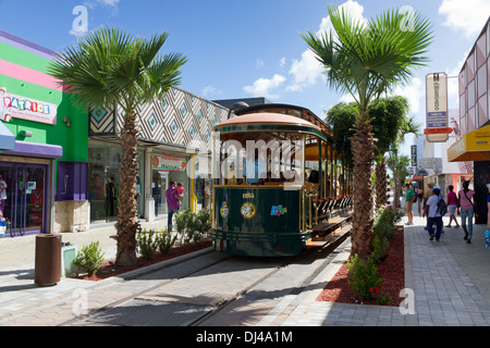 Tram runs through Oranjestad in Aruba Stock Photo