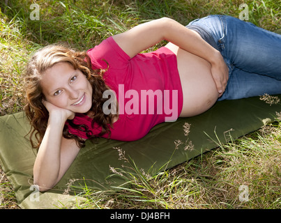 young woman relaxing on a meadow Stock Photo