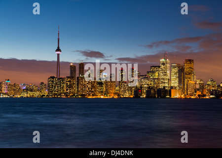 Toronto skyline across Lake Ontario, Canada at night / dusk Stock Photo