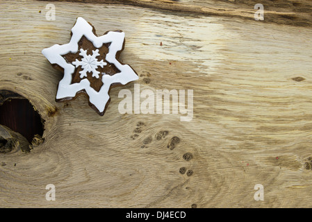 Traditional snowflake shaped Christmas gingerbread cookie Stock Photo