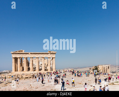 Acropolis, Athens, Greece - with crowds of tourists visiting the Ancient Greece site Parthenon and The Erechtheion Stock Photo