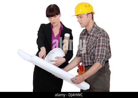 Tradesman consulting with an engineer Stock Photo