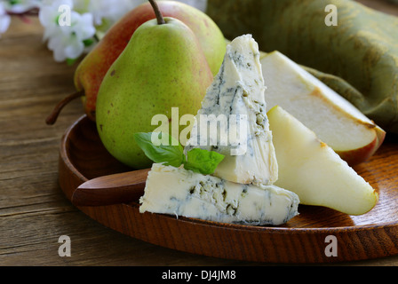 Blue cheese and pears on a wooden plate Stock Photo