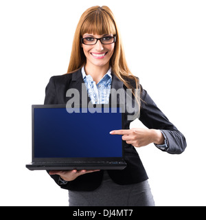 Portrait of a young woman holding a laptop and displaying a blank screen Stock Photo