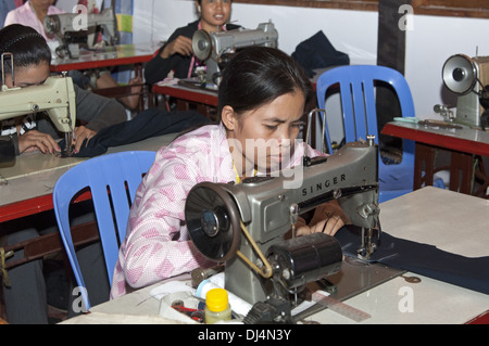 Sewing professional working in a tailor shop Stock Photo