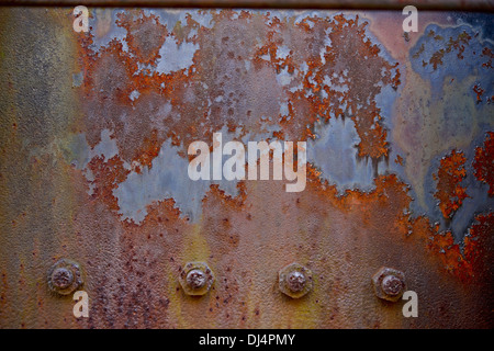 Rusty Metal Board Background. Corroded Metal Wall with Rivets. Stock Photo
