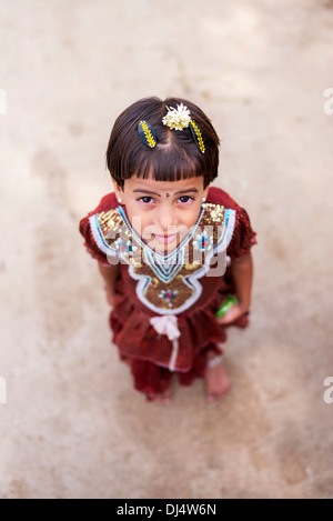 Young Indian girl in the street in a rural Indian village. Andhra Pradesh, India. Selective focus Stock Photo