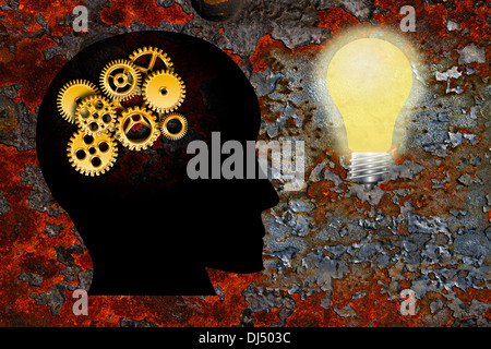 Gold Metal Gears on Human Head Silhouette and Lightbulb on Rusty Grunge Texture Background Stock Photo