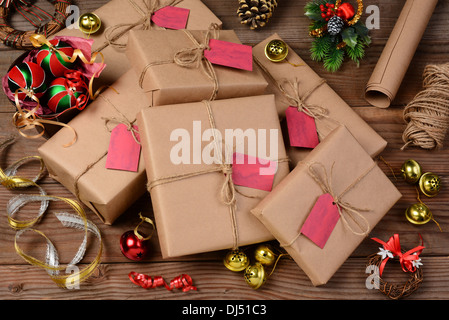 Christmas still life with eco friendly wrapping paper and supplies. Horizontal format shot from a high angle. Stock Photo