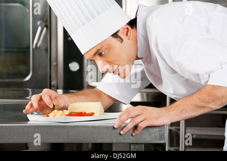 Chef Garnishing Dish Stock Photo