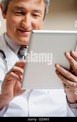 Doctor Using Digital Tablet Stock Photo