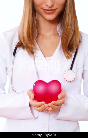 Female doctor holding heart. Close up Stock Photo