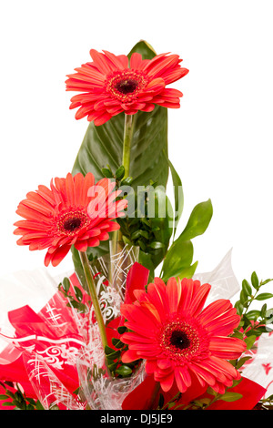 beautifully designed bouquet of three red flowers Stock Photo