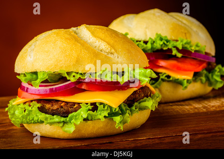 still life with two delicious american hamburgers or cheeseburgers Stock Photo