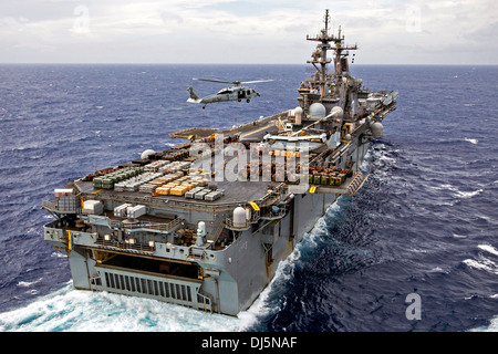 The US Navy amphibious assault ship USS Kearsarge conducts an ammunition offload October 30, 2013 in the Atlantic Ocean. Stock Photo