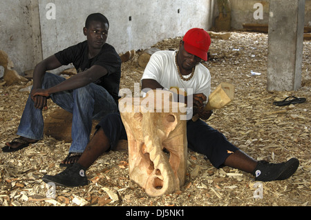 Wood carver at work, Ghana Stock Photo