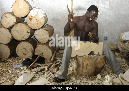 Wood carver at work, Ghana Stock Photo