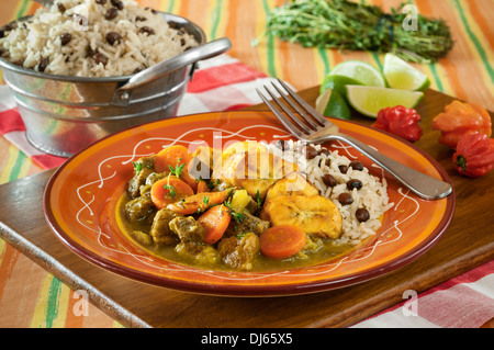 Curry goat with rice and gungo peas. Jamaica Food Stock Photo