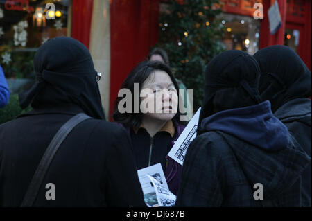 London, UK. 22nd November 2013. Burqua clad women at Anjem Choudary's Islamic Roadshow talk to local woman at protest to stop the Chinese oppression Against the Muslims of Xinjiang, Gerrard Street, London, UK, 22 November 2013 Credit:  martyn wheatley/Alamy Live News Stock Photo
