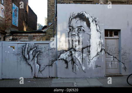 Mural street art by Guy Denning - portrait of woman in white scarf with ...