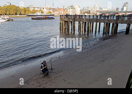 Flame Proof Moth (also known as Tim Siddall), performing in the River Thames, London. Stock Photo