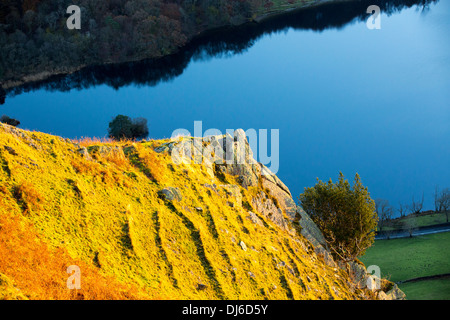 The last rays of evening light catching Nab Scar, looking down on Rydal Water, Lake District, UK. Stock Photo