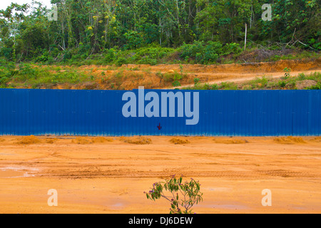 Blue fence to prevent unauthorised intrusion. Stock Photo