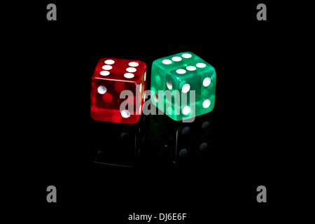 Two colour casino dice on a black background Stock Photo