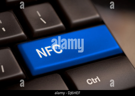 Computer keyboard with NFC technology. Message on keypad key. Stock Photo