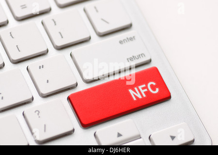 Computer keyboard with NFC technology. Message on keypad key. Stock Photo