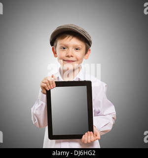 Happy boy with tablet computer. Child showing tablet Stock Photo