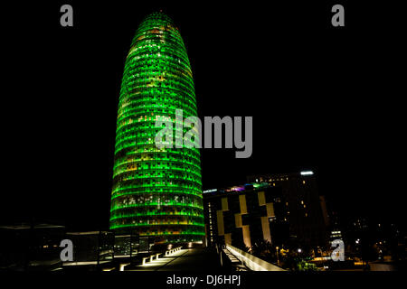 Barcelona, Spain. November 22nd, 2013: The facade of the 38 floors high Torre Agbar with its more than 4,500 luminous devices that can operate independently using LED technology displays a seasonal decoration out of moving lights and colors for Christmas time Stock Photo